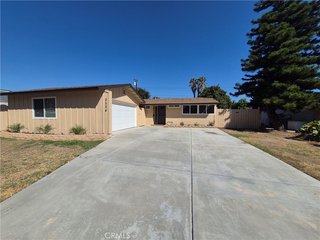 Stunning, Fully Remodeled Single-Level Home in Prime Location! This modern gem has been meticulously updated with no detail overlooked. The brand-new kitchen is a chef’s dream, featuring sleek quartz countertops, soft-close cabinetry, and high-end stainless steel appliances. A spacious open layout is enhanced by recessed lighting, new dual-pane windows, fresh interior and exterior paint, and a stylish wood-burning fireplace. Waterproof laminate wood flooring flows seamlessly throughout, with plush carpet in the bedrooms, each equipped with ceiling fans and modern lighting. Both bathrooms have been beautifully remodeled with quartz counters. The home is upgraded with a new roof and eaves, newer A/C, new tankless water heater, updated insulation and drywall, and PEX plumbing (copper in hall bath). Offering ample RV access, a long driveway, and a detached 2-car garage. Centrally located with quick access to freeways, entertainment, shopping, parks, and medical centers. This home is turnkey, modern living at its finest — ready for you to move in and enjoy.