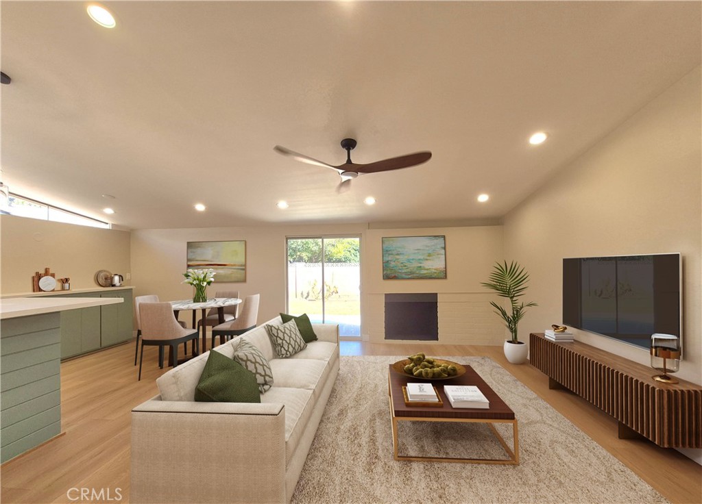 Stunning, Fully Remodeled Single-Level Home in Prime Location! This modern gem has been meticulously updated with no detail overlooked. The brand-new kitchen is a chef’s dream, featuring sleek quartz countertops, soft-close cabinetry, and high-end stainless steel appliances. A spacious open layout is enhanced by recessed lighting, new dual-pane windows, fresh interior and exterior paint, and a stylish wood-burning fireplace. Waterproof laminate wood flooring flows seamlessly throughout, with plush carpet in the bedrooms, each equipped with ceiling fans and modern lighting. Both bathrooms have been beautifully remodeled with quartz counters. The home is upgraded with a new roof and eaves, newer A/C, new tankless water heater, updated insulation and drywall, and PEX plumbing (copper in hall bath). Offering ample RV access, a long driveway, and a detached 2-car garage. Centrally located with quick access to freeways, entertainment, shopping, parks, and medical centers. This home is turnkey, modern living at its finest — ready for you to move in and enjoy.