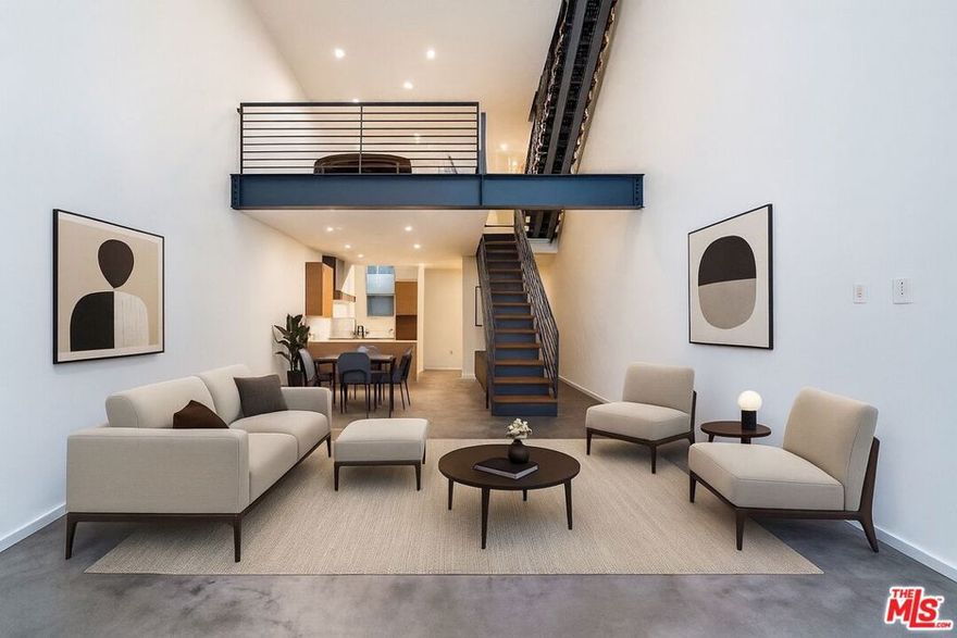 Available Now, Offered Unfurnished - Step into a world where modern design meets effortless West Hollywood living. This striking 2-bedroom + loft, 3-bath residence at the coveted Art Lofts blends industrial sophistication with architectural warmth, offering a rare sense of space, light, and style. Spanning approximately 1,830 sq ft across four airy, sun-filled levels, the home showcases 20-foot ceilings, dramatic Fleetwood windows, and a beautiful mix of polished concrete and hardwood floors. The open-concept living area flows seamlessly from a chef's kitchen with stainless-steel appliances to bright dining and lounge spaces that invite connection and comfort. The loft above offers endless versatility with the perfect home office, studio, or creative retreat. Start your morning with coffee on your private balcony and unwind at sunset on the spacious rooftop terrace overlooking the hills. Enjoy in-unit laundry, ample closet space, and two-car tandem parking with private storage. The gated 12-residence community offers guest parking and an onsite spa, just steps from Sunset and Santa Monica Boulevards, Whole Foods, and LA's best cafs, gyms, and restaurants. Refined, inspiring, and move-in ready, discover West Hollywood living elevated.