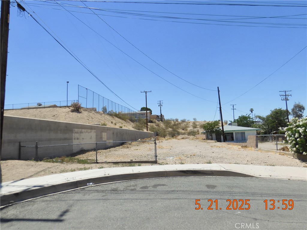 You will find this lot at the South end of 6th Ave, on the right hand side of the Cul-de-Sac. It's just past Pioneer St. There is a cinder block retaining wall that runs along (or near) the left border line of this parcel. Curbs, gutters & sidewalks already exist. All utilities may be available, Buyer to investigate during their inspection period. There is another lot, adjacent to the back of this parcel & fronting on Pioneer St that is also available separately for $29,000. Same Owner so could make offer on one or both. With the HUGE Santa Fe Expansion, already in progress, building lots are going to be in HIGH DEMAND.