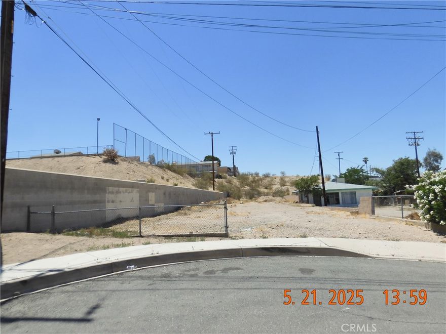 You will find this lot at the South end of 6th Ave, on the right hand side of the Cul-de-Sac.  It's just past Pioneer St.  There is a cinder block retaining wall that runs along (or near) the left border line of this parcel.  Curbs, gutters & sidewalks already exist.  All utilities may be available, Buyer to investigate during their inspection period.  There is another lot, adjacent to the back of this parcel & fronting on Pioneer St that is also available separately for $29,000.  Same Owner so could make offer on one or both.  With the HUGE Santa Fe Expansion, already in progress, building lots are going to be in HIGH DEMAND.
