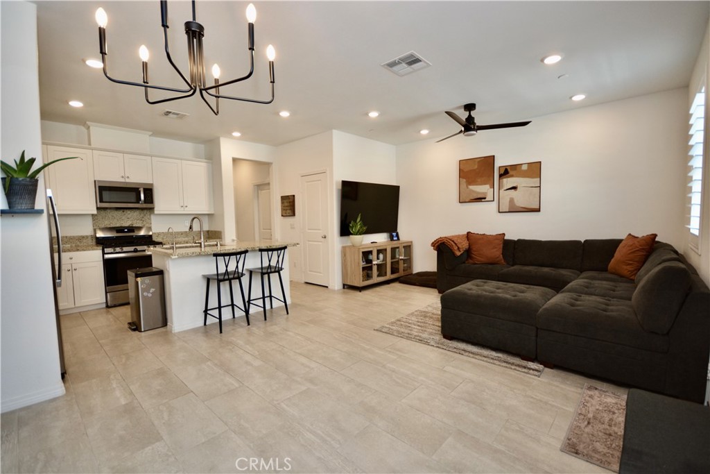 This property qualifies for a $20,000 Grant with may be used for down payment and/or closing costs!! Fully Paid Off Solar! This charming newly built, turn key townhouse has it all! This 2-story spacious unit with no neighbors above or below you is 3 bedroom and 2 1/2 baths designed for modern living. This home features upgraded beautiful tile flooring throughout, Granite counter tops with elegant white cabinets and custom white shutters for all windows for that fresh modern feel. Downstairs, you'll find a spacious open concept kitchen and living room with a 1/2 bath and a quaint front patio, which is ideal for relaxing. The home also includes a 2 car attached garage that enters directly into the kitchen. Upstairs, you'll find a generous size primary bedroom with private 5 piece luxury bath, a conveniently large Laundry room along with two great size bedrooms. The community amenities include a pool/spa, clubhouse, firepit, outdoor showers and scenic walking trails, all a convenient walk of 1 minute away from this home. Benefits of highly sought after top-rated Temecula school district, low maintenance, luxurious living in a prime location!! Fully paid for solar means lower costs for your utility bills and keeps this home affordable. Located close to parks, schools, shopping, award winning wineries and with easy freeway access for commuters.