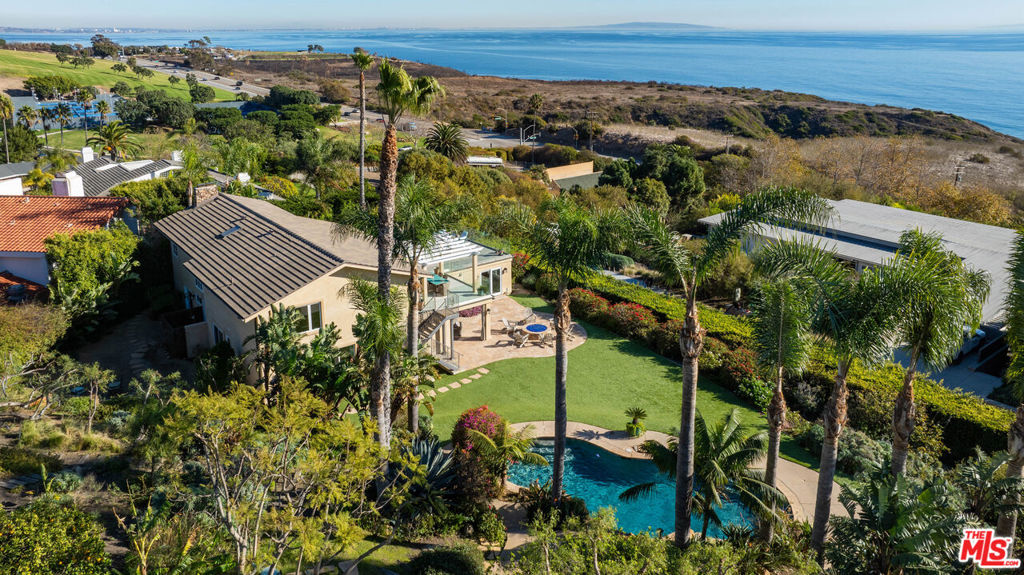 Experience resort-style living overlooking the ocean in this luxurious home in the heart of Malibu. Tucked away at the end of a cul-de-sac with a private drive and expansive motor court. This newly renovated 4-bedroom, 3.5-bathroom home offers unparalleled privacy and elegance in this beautiful Malibu enclave. With private retreat amenities and breathtaking ocean views, this home includes a pool with a cascading waterfall, spa, lush gardens, palm trees, and manicured lawns. Inside the home, experience the open concept living spaces with stunning ocean views from the kitchen, dining area, living room, and one of the two spacious primary bedroom suites. The lower of the two primary bedroom suites offers both steam and an outdoor shower. Plenty of room for morning workouts, including a media room. Ideal and perfect for entertaining, as the home also includes a large outdoor patio open to the living room that features the best ocean views the property has to offer, with spacious outdoor dining and seating areas, BBQ, cold storage and pizza oven. Take the staircase to the lower area and enjoy an outdoor, covered family room with a large TV and fire pit complimenting the lawn and pool area. Enjoy a serene pathway from the home leading through Bluffs Park to Malibu Road and the beach, as well as close proximity to Malibu's premier shopping, dining and weekly farmers' market. For added convenience, Pepperdine's nearby club membership offers access to am Olympic pool, track and tennis courts. This exceptional property combines privacy, luxury and the best of Malibu's coastal lifestyle.