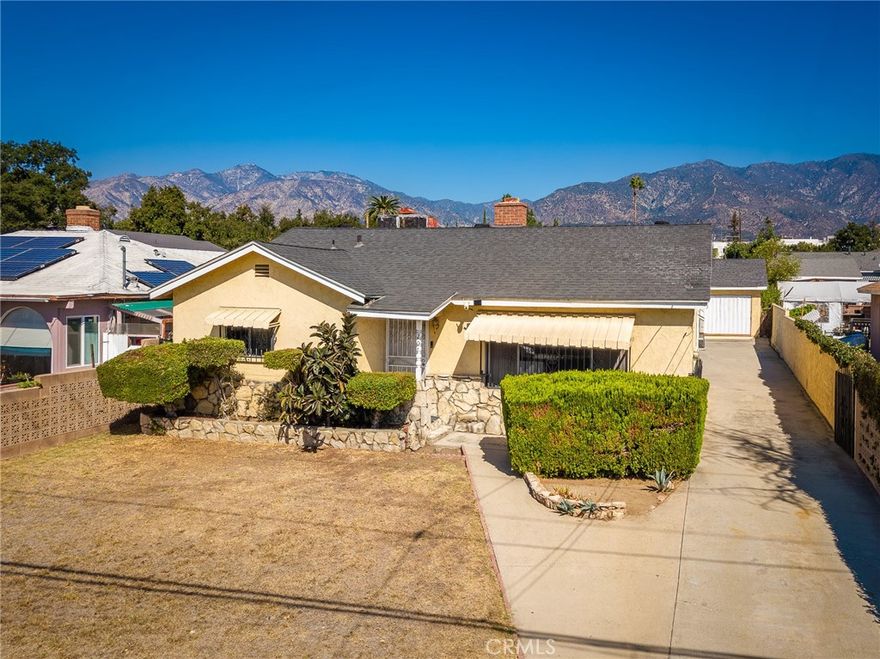Discover this single-story 2-bedroom, 1-bath home nestled in one of Monrovia’s most sought-after neighborhoods. Offering 992 sq. ft. of living space on a spacious 6,590 sq. lot, this property is brimming with potential for investors or homeowners ready to make it their own.  A welcoming front lawn sets the stage for your landscaping vision, while a large bay window fills the living and dining areas with natural light, highlighting the wood burning fireplace. The kitchen’s cheerful tilework adds a touch of vintage charm, making it both functional and full of character. Two cozy bedrooms share a well-maintained full bath with a shower/tub combo. The 3rd bedroom was converted into a family room overlooking the enclosed patio. An extended driveway leads to a detached two-car garage, offering plenty of parking and storage space. Ideally located near shopping, local schools, major freeways, and scenic hiking trails, this home provides easy access to Pasadena, mountain getaways, and SoCal’s vibrant attractions.  Whether you’re looking to renovate, expand, or simply enjoy as-is, this property is a rare find in a high-demand location—come explore the endless possibilities!