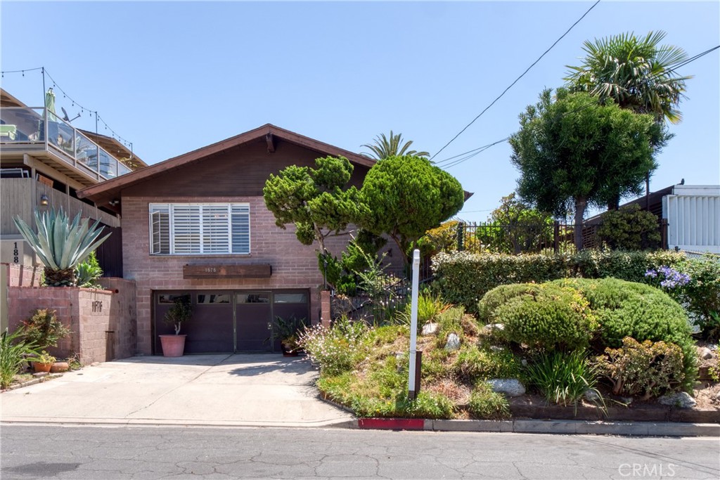 Welcome to 1878 Molino Avenue, in Signal Hill. This 2 bed/2 bath unique & very loved home with 2 car garage has 1,712 sq ft of living space, on a 5,200 sq ft lot. With small pool, walk in closet in primary bedroom. Original hardwood floors in living room. Fireplace in LR. Large backyard, great for pets and kids. Newly built large patio deck off of upstairs bedroom has city lights and panoramic views of Long Beach, the Harbor and Palos Verdes. Walk to Hilltop park, Skyline Trail & the civic center. Convenient location near Costco, Home Depot, shopping & restaurants. Approximately 2 miles to the beach; 3-4 miles to Belmont Shore. Easy access to 405,91,710, & 605 fwys. Great opportunity for its new owners to make it their own. Bring your designer & contractor.