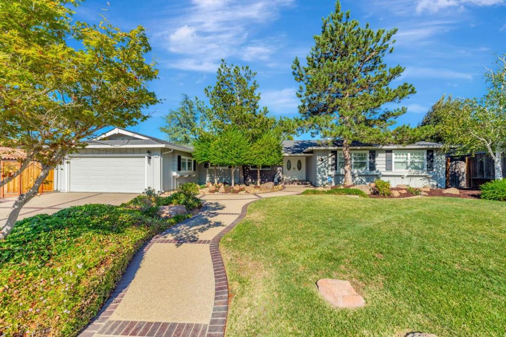 This stunning single-story Almaden home offers 2,570 sq. ft. of living space on a sprawling 13,000 sq. ft. lot in one of the areas most coveted neighborhoods. Featuring 4 spacious bedrooms and 2.5 bathrooms, the residence includes a formal living room and a family room, both with cozy fireplaces. Enjoy meals in the formal dining room or the large kitchen with an adjoining eating area. An inside laundry room adds convenience, and dual-zone heating and air conditioning ensure year-round comfort. With east-west sun exposure, the home receives ample natural light throughout the day. Step outside to your private backyard oasis, perfect for entertaining or relaxing. The beautifully designed space boasts elegant paver hardscaping, a sparkling vinyl pool, and a custom stone BBQ area complete with a built-in grill, refrigerator, sink, and wood pergola for outdoor dining. A generous play area makes it ideal for family fun and large gatherings. Conveniently located near hiking trails, parks, shopping, and dining, this home is also part of the highly regarded Simonds Elementary, Castillero Middle, and Leland High School district. Combining comfort, style, and the ultimate Almaden lifestyle, this exceptional single-story residence is ready to welcome its next owners.