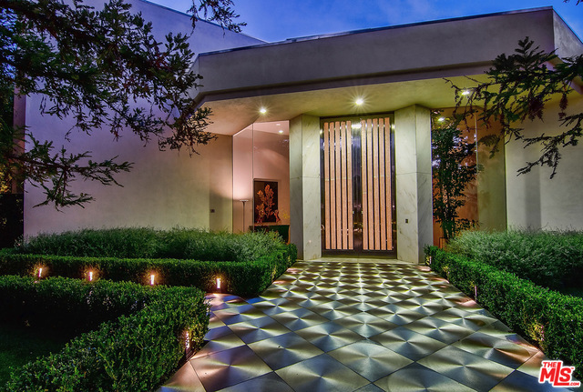 Situated on a private cul-de-sac in the prestigious neighborhood just above the Beverly Hills Hotel, this dynamic Contemporary Estate is nothing short of a masterpiece. Offering apx. 14,000 sq.ft. of living space with epic scale, incredible volume, & the finest quality finishes. This property has been impeccably updated & restored while still preserving the classic style & elegance of a bygone era. Front courtyard w/redwood trees, motorcourt & 3-car garage. The voluminous living room is worthy of a luxury hotel lobby w/2-story walls of marble & glass. Sunken bar, formal dining rm, & tremendous open kitchen w/52ft island, prof. appliances & separate catering space. 2 guest bdrm suites up & vast master suite w/balcony, dual marble bths, & walk-in closets. Lower level staff suite. The incredible grounds were designed for entertaining w/outdoor living rm, lawn, pool & spa. The 3-story gsthse is a full 2nd residence w/living rm, dining, kitchen, 3 bdrms up, & lower level full apartment.