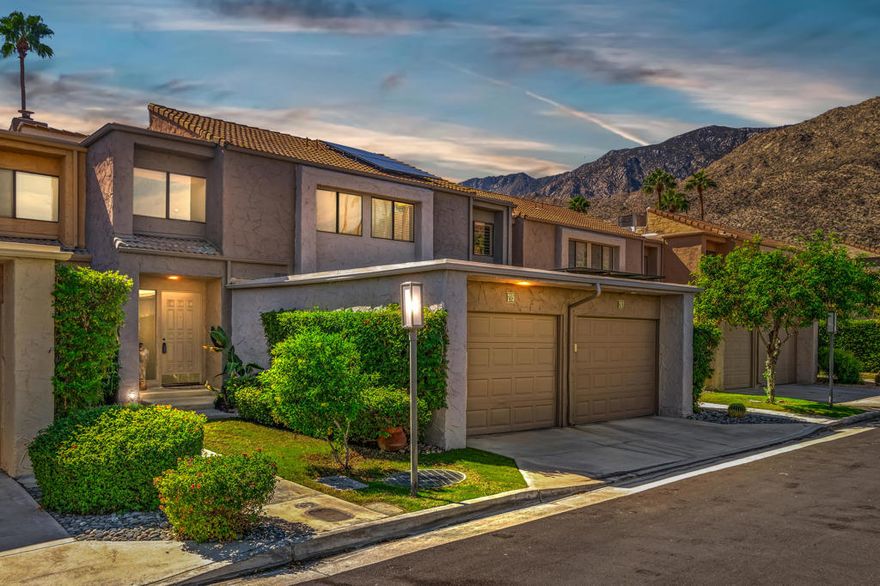 Discover the epitome of modern desert living in this revitalized 2-bedroom, 3-bath townhome, now being offered fully furnished. Embrace the elegance of a classic 1979 Hugh M. Kaptur design while enjoying contemporary upgrades that blend luxury with comfort. The inviting step-down living room, adorned with a cozy gas fireplace, opens through sliding glass doors to a generous patio. Here, you'll bask in the serene views of mature citrus trees, all while gazing at the sparkling community pool and spa. The kitchen is a chef's wonder, featuring sleek stainless steel appliances and ample counter and storage space, perfect for any culinary endeavor. Each bathroom has been thoroughly modernized, including the conveniently located powder bath on the main floor. Upstairs, you'll find two sunlit ensuite bedrooms. The primary suite offers a personal retreat with a gas fireplace, a wet bar, three closets (one cedar-lined), and breathtaking mountain views from it's spacious balcony. Newer tile flooring and freshly painted walls stretch throughout, adding an exciting stylish touch to the home. Nestled in the sought-after Canyon West Estates of South Palm Springs, this townhome is only minutes away from downtown Palm Springs' vibrant dining and shopping scene, with easy access to nearby hiking and biking trails. Experience the perfect blend of relaxation and excitement in a pet-friendly, vibrant, and secure gated community. Your ideal desert lifestyle awaits!