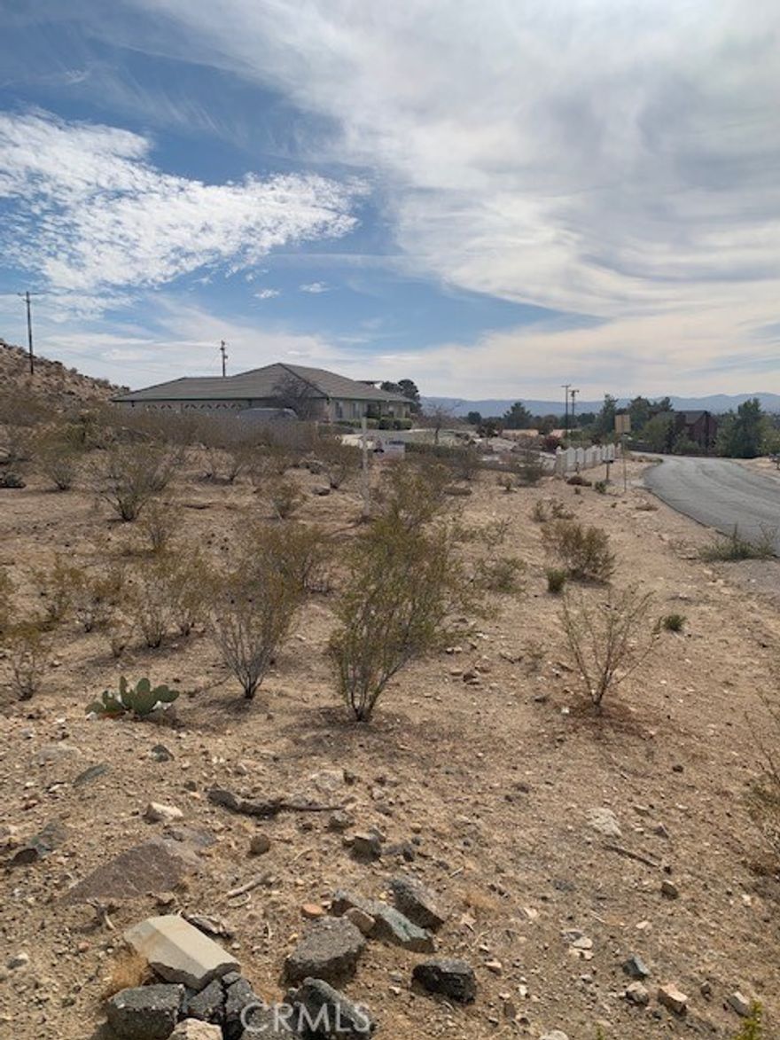 Build your dream home on this great location Lot with a beautiful desert and Mountain and city lights views, and available Utilities, beautiful single-family homes already built near this Lot, close to Hwy 18 and easy access to I-15 Fwy. 
Don't let opportunity pass by.!!!