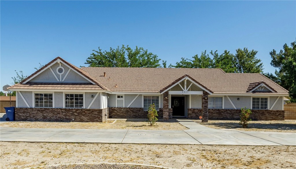 Here is your opportunity to own your ranch in the prestigious Rancho Tierra del Sol community in Lancaster. This unique and affordable single-story house is situated on a 40,000 sq ft all fenced flat lot. 3Br+3Ba+Den( can be easily the 4th bed), Family Room with brick fireplace,Living Room, Laundry Room, central A/C, extended cover patio, custom built BBQ ranch, extra large 3 cars attached garage, open floor plan kitchen with center island.Master bath with hot tub, laminate floors, circular driveway with 2 gate entrances, huge gated RV parking, it has spaces for all your RV's, utv's , trucks. Zoning LRRRR1: bring your horses!!. Quiet area, Seller motivated, Buyers do not miss this opportunity!!!