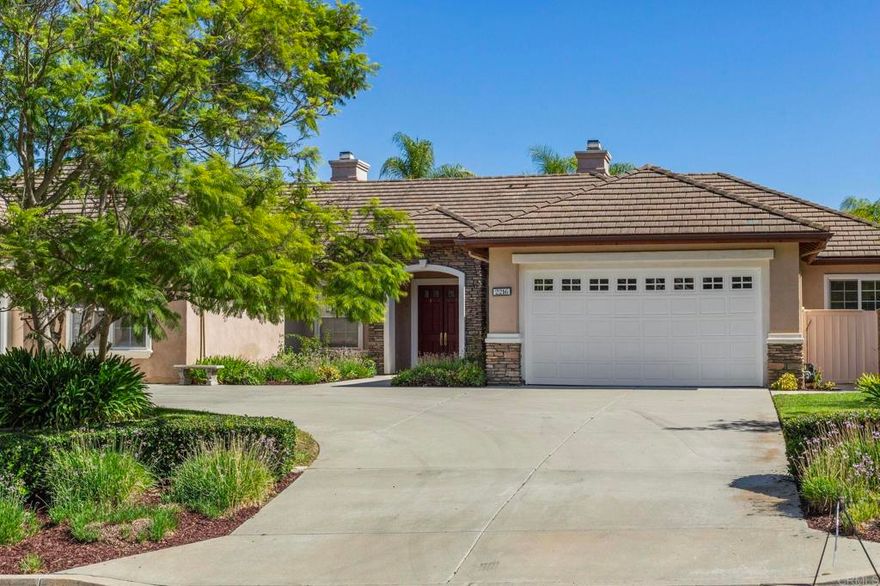 Stunning single-story home nestled in prestigious Rancho Verde Estates that seamlessly integrates indoor comfort with outdoor resort-style living. This grand residence is situated in a cul de-sac and features 4 en suite bedrooms and an additional spacious den/office with custom built-ins. Elegant living room with cozy fireplace and french doors leading to the peaceful and serene backyard. Modern open-concept kitchen with leathered granite countertops, large island, dual oven, and five burner stove is ideal for culinary enthusiasts. Dining area flows into the inviting family room with designer built-ins, fireplace, and wine refrigerator. Extra lounge area alongside a versatile workout space or multipurpose room creates greater flexibility for every need. Generously sized master retreat with walk-in closet, expansive sitting area, soaking tub, dual sinks, and vanity area. Separate laundry room with sink and ample storage. Entertain or relax in the private backyard oasis boasting a portable fire pit, barbecue island equipped with gas grill, side burner, fire pit, and refrigerator, luxurious solar-heated pool with tranquil waterfalls and lights, soothing spa, and a covered patio with speakers, recessed lighting and fans. Surrounded by tropical landscaping, this stunning retreat offers breathtaking mountain views and unforgettable sunsets. Embrace the exceptional lifestyle this home offers!