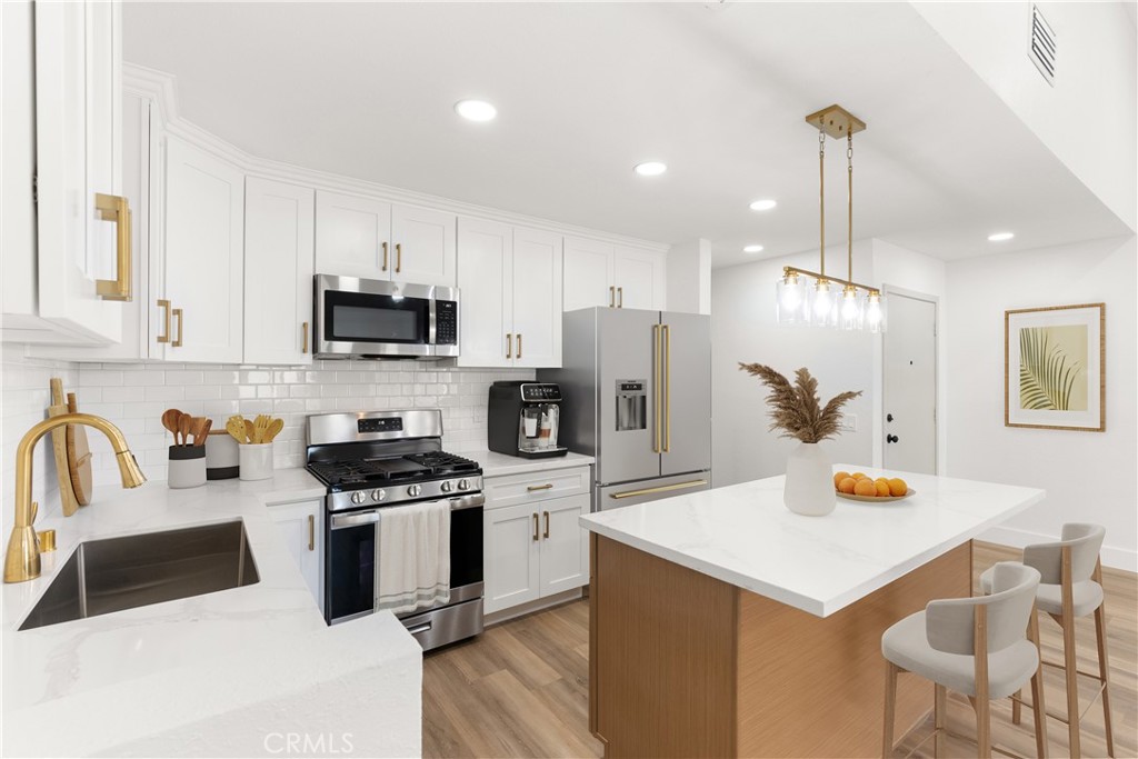Welcome to Marbrisa Villas—where modern living meets style and comfort in this fully reimagined townhome at 87 Tennessee Street, Unit C, Redlands. Spanning 1,196 sq ft, this beautifully renovated residence features two expansive primary suites, each thoughtfully positioned on separate levels for optimal privacy and convenience.
Every inch of this home has been upgraded with care and sophistication. The heart of the home—the kitchen—now boasts brand-new cabinetry, an open-concept layout, a large center island with quartz countertops, and all-new stainless steel appliances. Recessed lighting throughout the home highlights the fresh finishes, while new luxury vinyl plank flooring adds warmth and durability.
The open living area is perfect for relaxing or entertaining, featuring a cozy fireplace and a private balcony ideal for your morning coffee or evening unwind. A convenient half bath on the main level adds functionality for guests.
Major updates include a brand-new central A/C system (installed in September 2023), and new double-pane windows and sliding doors that enhance energy efficiency and year-round comfort. The private backyard patio provides the perfect outdoor retreat or entertaining space.
An attached garage with direct access to the laundry room adds everyday ease. Move-in ready and designed with modern taste, this townhome offers turnkey living with the added charm of a peaceful, well-maintained community.
Enjoy all the amenities Marbrisa Villas has to offer, including a sparkling pool—perfect for relaxing on warm California days.
Don’t miss the opportunity to own this thoughtfully upgraded gem in the heart of Redlands!