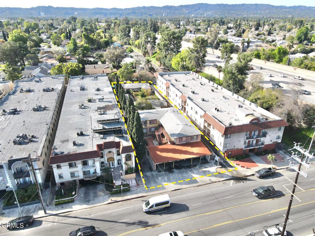 This property in Van Nuys, California, presents a prime covered land opportunity featuring an existing eight-unit apartment complex situated on a +/-20,650 square foot lot, with a total rental unit space of +/-6,870 square feet. Currently, there are four vacant units that upon lease up will be generating a monthly income of $16,708, the property includes two single-family homes alongside the six-unit apartment complex that have been outfitted with all copper plumbing and newer roofs. For developers, the site offers unlimited density for affordable housing projects, allowing for flexible unit design and the potential to build up to 39 units under transit oriented community guidelines. Conveniently located adjacent to the 405 Freeway, with easy access to Highway 101 and Lake Balboa Park, this location provides excellent connectivity and development potential.