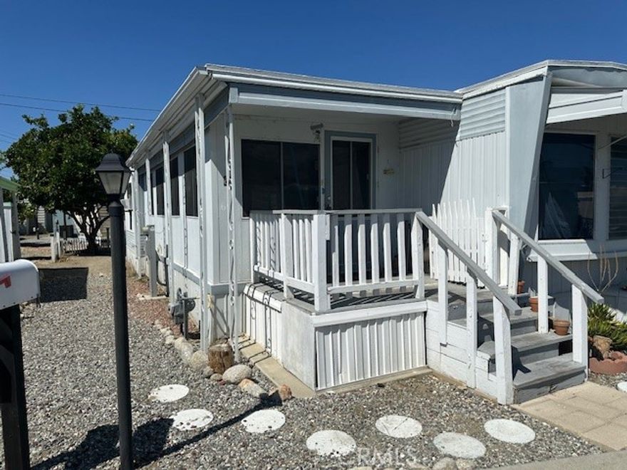 55+ Scenic Community of Rancho De Anza. This 2 Bed/1 Bath home is a fixer and needs flooring, some windows fixed, swamp cooler fixed and some paint. It does not have a refrigerator. Roof is good. 2019 water heater. Furnace was maintained. Has two window Air Conditioners.Large added on enclosed room.  Big windows in front with views of the Idyllwild mountains. Front porch facing the mountains. Backyard has an fenced area with a mature orange tree.

Park offers a Clubhouse, swimming pool and jacuzzi. Affordable park rent of $550.00.