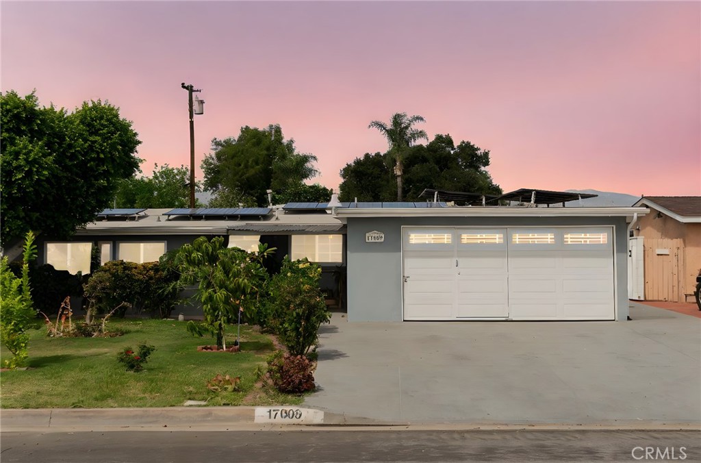 Discover your dream home at 17009 E Tudor St, Covina – a clean and upgraded 4-bedroom residence plus versatile bonus room that checks every box. Equipped with 20 fully PAID solar panels, this energy-efficient gem offers significant monthly savings without lease obligations. Modern enhancements include Cool Life exterior paint, a new front door and garage door, a clean upgraded kitchen, new dual-pane windows throughout for superior comfort, completely renovated bathrooms, and a recently replaced sewer lateral line ensuring worry-free ownership. The spectacular dual-patio backyard transforms outdoor living into pure luxury, featuring an abundant fruit orchard with Washington oranges, mandarins, guava, lime, mango, and avocado trees – harvest fresh produce steps from your door! This exceptional property seamlessly blends sustainable living, thoughtful updates, and the quintessential California lifestyle into one incredible package.