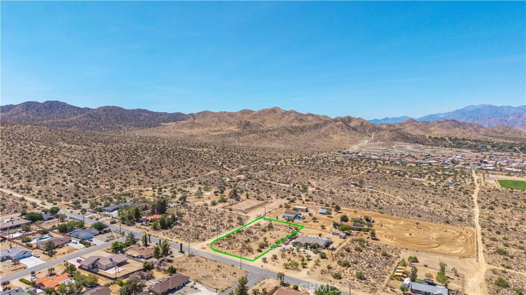 Fantastic opportunity to create your dream home on a full acre in one of Yucca Valley’s most desirable locations. This spacious parcel offers lovely desert and mountain views, easy access, and room to design the home and lifestyle you’ve been envisioning.
Enjoy the best of Hi-Desert living with Joshua Tree National Park just minutes away for world-class hiking, rock climbing, and stargazing. The property is conveniently close to schools, shopping, and local dining, yet maintains a peaceful setting with wide open skies. Palm Springs, with its dining, culture, and airport access, is less than an hour’s drive.
Whether you’re looking to build a full-time residence or a weekend retreat, this property provides a wonderful canvas in an area where demand is growing and opportunities like this are rare.
