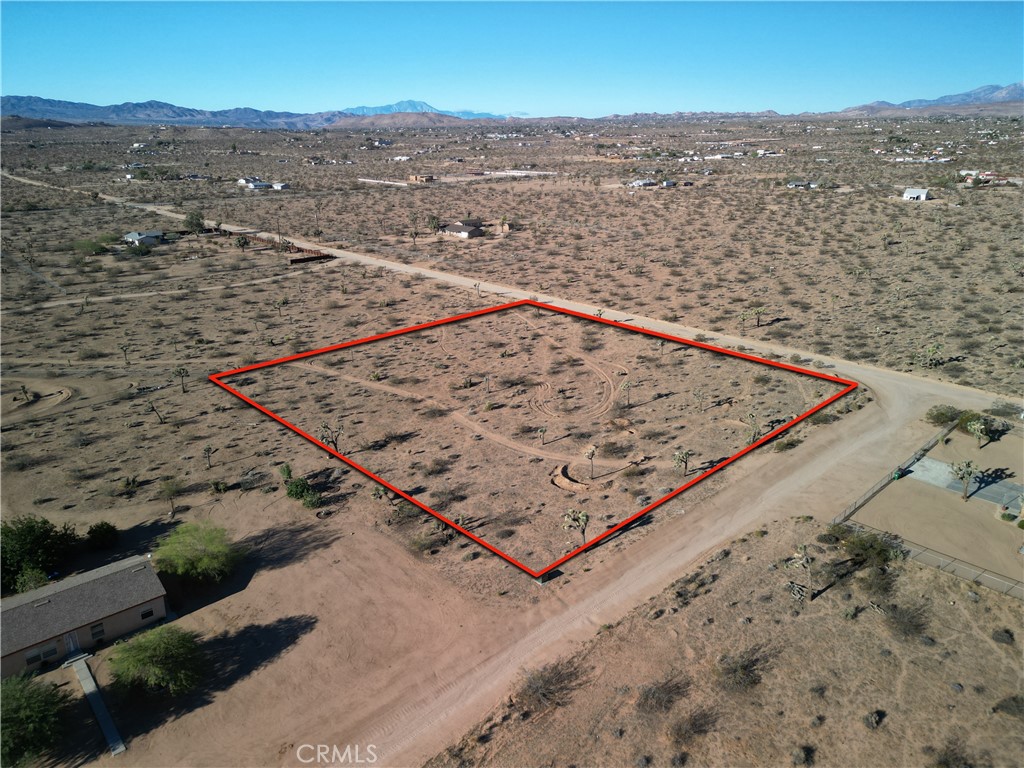If your looking for a real nice buildable lot, then you need to take a good look at this property. 2 acres with great views and under ground utilities. Property is located just minutes from town and just a short drive to Joshua Tree National Park. You need to come check this out.