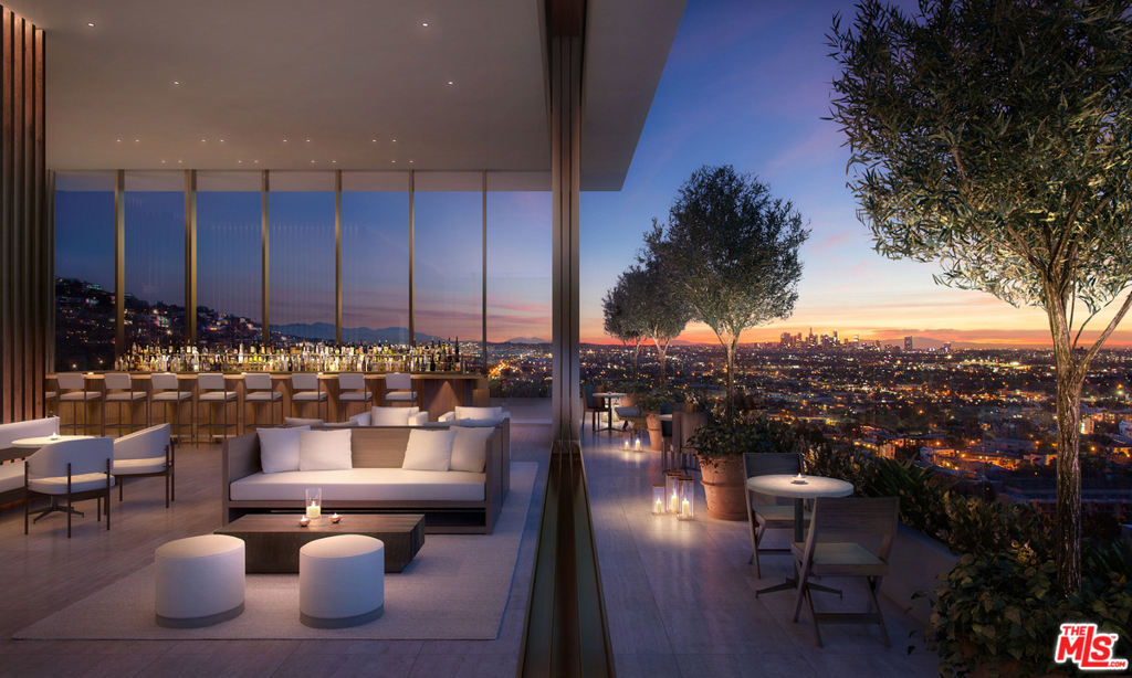 Residence 1103 boasts 2311 square feet of interior living space with 3 bedrooms, 3 full baths and a powder room plus two glorious terraces each over 40' in length offering sweeping panoramic southern views of the Hollywood Hills, Beverly Hills, Century City, and the Downtown LA skyline. Sliding walls of glass open to create a sprawling approx. 27' x 27' indoor/outdoor Great Room opening to a deep 8' terrace. The elegant, custom John Pawson-designed teak Molteni kitchen features teak cabinets and Vola brushed chrome fixtures. The oversize master suite offers a light-filled master bath with John Pawson custom-designed, freestanding concrete tub, large walk-in closet, and oversize master bedroom. The master bedroom and master bathroom both open to a second 40' terrace. A 35' entry gallery and two secondary bedrooms each with en-suite bath complete this home. The residences include John Pawson custom designed doors with flush frames integrated into wall finishes throughout.