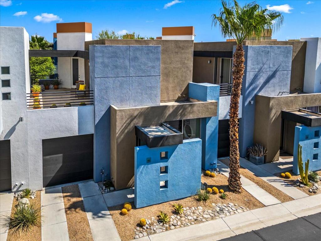Modern elegance meets low-maintenance living in this impeccably maintained 2-bed, 2.5-bath Plan B townhome in Palermo. Downstairs features polished stained concrete flooring, an open living/dining space, a powder room, and a fully redesigned chef's kitchen (2021) with new appliances, plenty of storage, a display shelf, and a California Closets built-in office area. Step outside to your own private oasis: a fully landscaped backyard with an irrigation system.Upstairs, both bedrooms feature en-suite baths, reed glass doors, and are thoughtfully separated for maximum privacy. Each room includes its own closet, with a fully custom California Closet system enhancing storage and organization. The newer upstairs flooring (2019) is stylish, durable, and pet-friendly. A laundry closet, a private sun deck with stunning mountain views, and thoughtful touches like custom blackout shades, a new garage door (2019), and an upgraded A/C system (2020 with smart thermostat) make this home both beautiful and functional.Palermo is a private gated community featuring two pools, two spas, a fitness center, and a clubhouse with TV lounges, billiards, and a full kitchen. Fee simple land--you own it!
