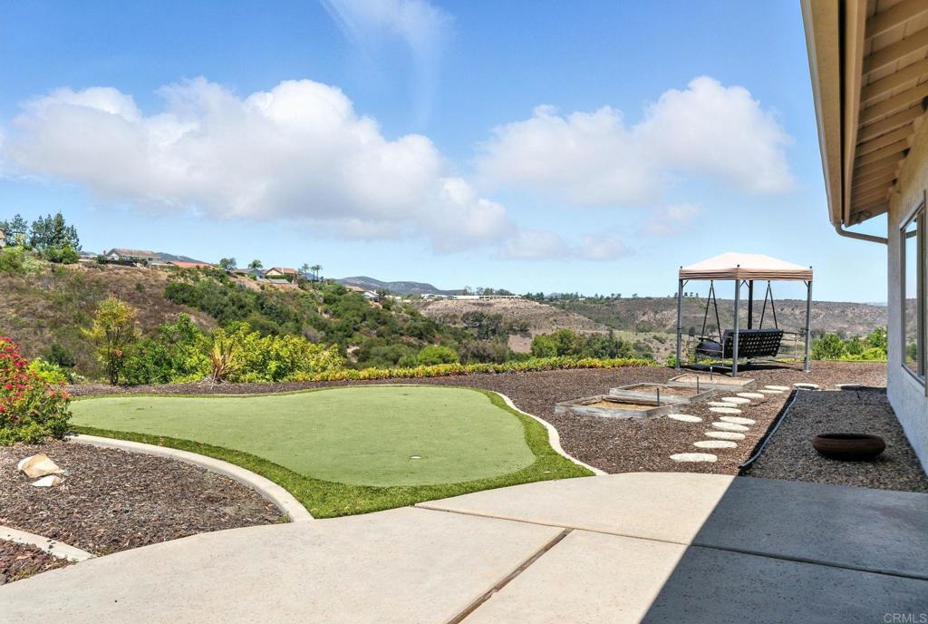 This is the one! Stylish Fletcher Hills Beauty in a a Cul-De-Sac with Panoramic Views. Tucked away in a quiet Fletcher Hills Cul-de-sac and located within a highly rated school district, this beautifully updated 3 bedroom 2 1/2 bath home offers the perfect blend of comfort, style and outdoor living. Inside, you’ll find a spacious, open floor plan with luxury vinyl plank flooring throughout the main level and fresh neutral tones that create a warm and modern feel. The kitchen features sleek quartz counter tops and ample storage. Ideal for everyday living and entertaining, the ample formal dining room is spacious enough for all your gatherings. The living room offers vaulted ceilings and invites conversation while the casual family room creates space to enjoy quiet evenings at home snuggled up near the fireplace in those cooler months. The enormous primary suite is a true retreat with a spacious balcony, two closets and walk in shower. The additional bedrooms are perfect for family, guest rooms, or a home office. Step outside to take in the panoramic views and experience spectacular sunsets. Enjoy your private putting green, raised garden beds and fruit trees! This place is an entertainer’s dream and gardener’s paradise! Come make this gem your own today!