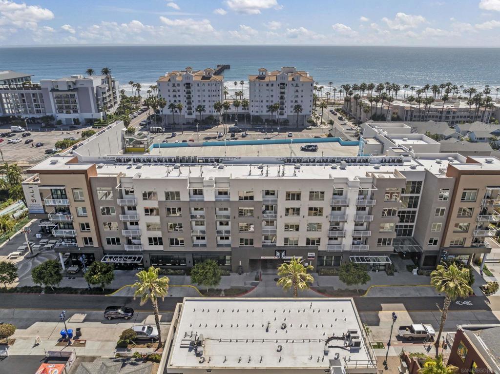 Welcome To SALT. This distinctive condominium, just two blocks from the beach, has a light and airy open floor plan. Enjoy Ocean breezes and views from your private deck. European-style kitchen cabinets with quartz countertops and GE GAS appliances await you. The 5-year-old home has new window treatments, a new Samsung Full-Size Washer/Dryer, new carpet and pad, and new Closet Organizers in the walk-in closet. SALT is in the heart of Downtown Oceanside just 2 blocks from the pier and beach. Walkable to shopping, culinary venues, gastropubs, entertainment, and local events. The Amtrak Station is 3 blocks south. We have a 94% walkability rate! The amenities include a rooftop lounge, clubhouse, game area, fire-pit for gathering, BBQ grills, bike storage & repair shop, surfboard, beach gear storage & shower, sunset lanai, resident lounge, conference room, EV & bike charging stations. The parking structure is double-gated for security.