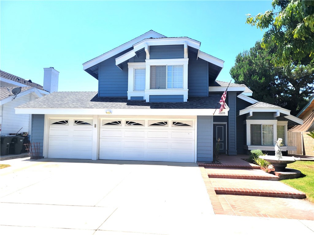 FIRST TIME ON MARKET SINCE 1985! This spacious 4-bed, 3-bath Lakewood home offers 2,241 SQ FT of functional living space on a generous 60-FT-WIDE LOT. Curb appeal includes a freshly painted blue exterior, gabled rooflines, manicured lawn, fountain, DOUBLE-DOOR ENTRY, and a 3-CAR ATTACHED GARAGE W/ DIRECT ENTRY. Inside, a dramatic CENTRAL STAIRWELL with wood handrails and white balusters anchors the home, rising from the formal living room and leading to all four upstairs bedrooms. Enjoy VAULTED CIELINGS, formal living and dining rooms, an extended family room with FIREPLACE and SLIDING GLASS DOORS to a PERGOLA-COVERED PATIO, and a REMODELED DOWNSTAIRS BATH (2023). The EAT-IN KITCHEN features updated countertops, backsplash, a center island, and ceramic tile flooring. Upstairs, the spacious PRIMARY SUITE offers a walk-in closet, sitting area, and vaulted ceilings. FLOORS, PAINT, AND CABINETRY REFLECT LIGHT, EXPECTED WEAR, while systems are functional and layout is move-in ready. Bonus highlights include CUSTOM WOOD SHUTTERS, a detached wooden shed, and concrete pad with pergola frame—perfect for buyers eager to settle in and CUSTOMIZE OVER TIME in one of Lakewood’s most sought-after neighborhoods.