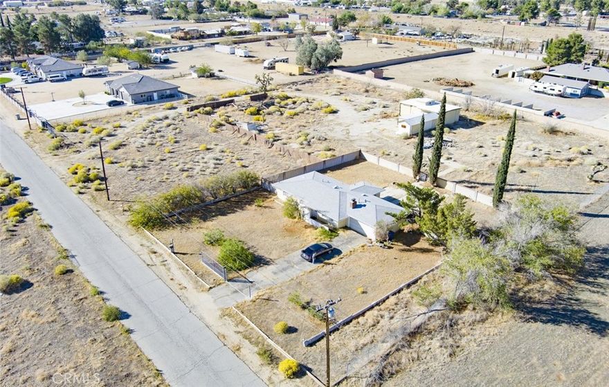 This 3 bedroom 2 bathroom is perfect for investors.  This is also horse property.  Large fireplace in living room.  A little over 2.5 acres.  Close to 14 freeway, shopping and restaurants.