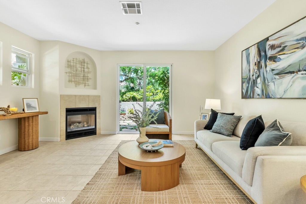 Welcome to 6118 Citracado Circle, a beautifully refreshed 3 bedroom, 2.5 bathroom condo nestled in the community of Valencia at Rancho Carrillo. This highly desirable two-story prime location corner unit was just updated in August 2025. This is the largest floorpan in the Valencia development. As you step inside this inviting open floor plan, you'll discover features including a family room with a cozy fireplace and sliding door leading to the very private and serene courtyard in a great location. Jacaranda trees fill your view from the patio, in bloom each spring. Brand new baseboards and paint throughout entire house. A crisp, remodeled kitchen with quartz countertops, stainless steel appliances (including a new french door GE refrigerator and new GE dishwasher). All brand new carpeting upstairs. The primary bedroom boasts a spacious walk-in closet and ensuite bathroom which includes a dual sink vanity and quartz counters. Brand new standing spa-like shower with frameless glass enclosure. New wide-plank laminate wood flooring and new toilet. Second bathroom upstairs has a quartz counter and new wide-plank wood laminate flooring. Primary bedroom and one of the secondary bedrooms include new ceiling fans creating a cool and comfortable atmosphere year-round. This property features a large direct access 2-car garage with a much desired extra storage area inside. The garage opens into the house's indoor laundry area. This lovely community is adjacent to the beautiful 27-acre Leo Carrillo Ranch Park. The Rancho Carrillo Master Association has a heated lap pool/recreation pool with jacuzzi and miles of walking, hiking and biking paths. The Valencia complex offers a pool and hot tub along with BBQ area, tables and a playground to enjoy. Rancho Carrillo has a clubhouse and an award-winning Elementary School in close location to this property. Nearby Bressi Ranch has shopping, restaurants, services and grocery stores. Experience the best of Carlsbad's climate, beach breezes and coastal lifestyle. This is your chance to live in the beautifully updated 3 bedroom home you have been waiting for! This is the first time this property has been on market since it was initially sold new in 2000. Excellent location with access to convenient street parking for friends and visitors. Enjoy the serene neighborhood views and all the amenities that Valencia at Rancho Carrillo has to offer. Don't miss this opportunity to own a slice of paradise in Carlsbad!