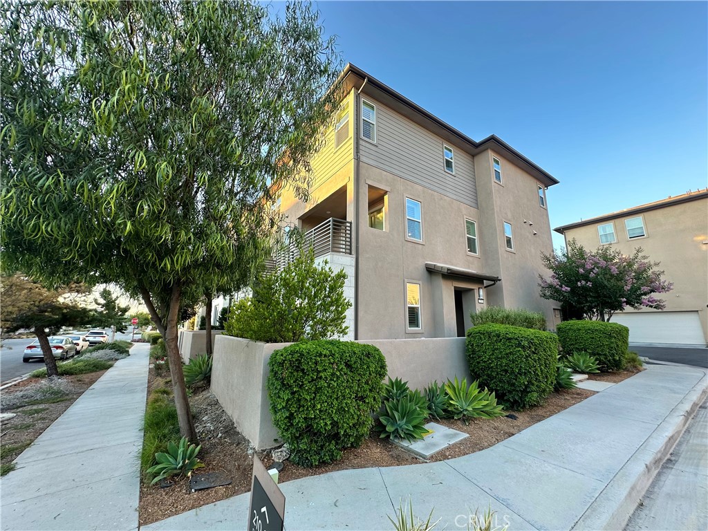 Now available in the highly sought-after Great Park community! This corner unit three-story home offers 4 spacious bedrooms, 3.5 bathrooms, and a 2-car garage. Enjoy an open-concept layout with abundant natural light, modern finishes, and a private balcony perfect for relaxing or entertaining. The kitchen features sleek cabinetry, quartz countertops, and stainless steel appliances. With one bedroom and full bath on the entry level, it’s ideal for guests or a home office setup. Additional guest parking is conveniently located in the rear, making hosting easy. Close to top-rated schools, parks, trails, and all the amenities Great Park has to offer.
Available now – don’t miss your chance to lease this beautifully designed home!