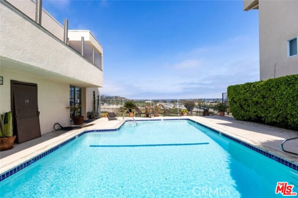 This charming, one level condominium has been recently updated. It has two bedrooms, two full bathrooms, a nice living room with a dining area, and an open kitchen with white, solid wood cabinetry. This unit features wood floors, french doors and a new sliding door that takes you to an enchanting patio where you can enjoy ocean views and quiet times. This is the only unit in the complex to have this amazing patio approved HOA covenant to run with the land with exclusive use to the homeowner. This unit has two covered parking spaces close to the unit with the ocean breeze ventilated, carport style garage.. This exclusive gated community has a guard onsite 7 days a week, providing much privacy and security. The complex amenities offer a sparkling heated pool with stunning ocean views and lounge chairs for sunbathing and quiet relaxation. It has a fully equipped fitness room and a tennis court. This condominium is conveniently situated within walking distance to Pepperdine University, Webster and fine grammar schools, whole foods, trendy shops, amazing restaurants, and world famous beaches.