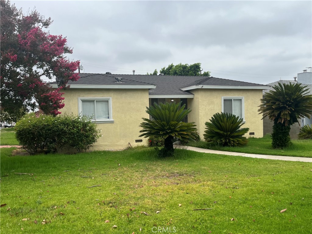 Charming single-story home on a large lot close schools, parks, shopping, and downtown Corona. This 1,900 sq.ft. home features a unique floor plan with living room, dining area, kitchen, 2 bedrooms and 1 bath, plus back part of this home with spacious family room with fireplace, 1 bedroom with its own bathroom, and indoor laundry area with washer/dryer hookups. Plenty of cabinet space in the hallway. Large backyard with covered patio and open patio. Easy access to 91/15 freeways.