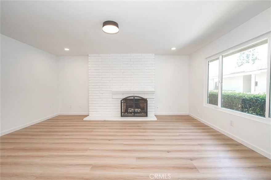 UPGRADED FIRST-FLOOR UNIT WITH 2 BEDROOMS AND 2 BATHS IN THE GATED COMMUNITY OF TUSTIN VERDES! Step inside a remodeled interior space. Once you step inside the unit, will immediately notice how nicely upgraded the inside is, with the wood flooring throughout and recess lighting. The living room is spacious and includes a fireplace, perfect to cozy up to on those cold evenings. Windows throughout to let plenty of natural light in. The upgraded kitchen includes stainless steel appliances, a quartz countertop, a stainless sink, a stainless steel dishwasher, and white color cabinets with plenty of storage space, kitchen is situated where you can look out to your outdoor patio space and dining area. Separate dining area, that can open up to the outdoor patio space, which is perfect when entertaining guests. Total 2 beds and 2 baths all upgraded with modern finishes. The primary bedroom includes its own primary bathroom that is upgraded with modern finishes. Detached 1-car garage. Conveniently located near many restaurants, shops, markets, and easy access to the 5 or 55 freeways.