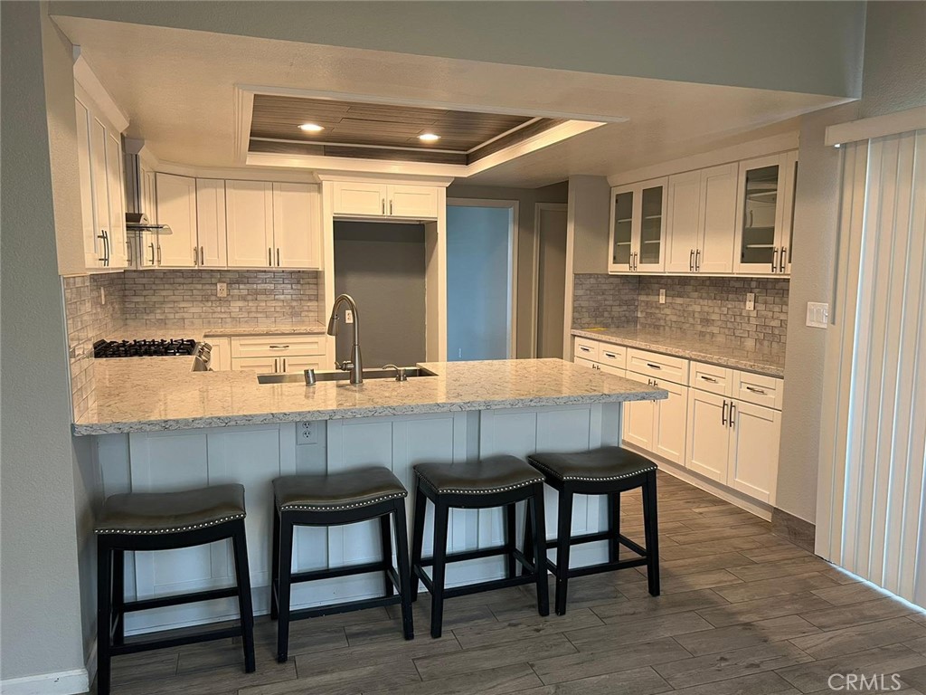 Welcome to your luxurious oasis in the coveted Rio Vista Elementary neighborhood of Apple Valley! This meticulously crafted residence offers an ideal blend of sophistication and comfort, featuring 4 bedrooms and 2 baths to accommodate your every need.
As you step through the front door, you'll be greeted by the elegance of tile flooring that seamlessly flows throughout the entire house, creating a sleek and cohesive design. The heart of this home is undoubtedly the brand-new kitchen, equipped with modern appliances, quartz countertops, and ample cabinet space. It's a chef's delight, promising a delightful culinary experience for every meal.
The master suite is a sanctuary of relaxation, complete with a jetted tub in the ensuite bathroom, providing a perfect retreat after a long day. The additional three bedrooms offer versatility for a growing family, guests, or even a home office.
One of the standout features of this property is the expansive backyard, a haven for outdoor enthusiasts and entertainers alike. Picture yourself hosting unforgettable gatherings on the large patio, surrounded by lush greenery and enjoying the California sunshine. The corner lot adds an extra layer of privacy and space, making this backyard a true retreat.
For added convenience, this home boasts a dedicated laundry room, making daily chores a breeze. With every detail carefully considered, this property offers a seamless blend of functionality and style.
Situated in the Rio Vista Elementary neighborhood, you'll benefit from the community's friendly atmosphere and the convenience of nearby parks, schools, and shopping centers. Embrace the Apple Valley lifestyle with ease.
Don't miss the opportunity to make this stunning 4-bedroom, 2-bath home with a huge backyard, jetted tub, new kitchen, laundry room, tile throughout, and a large patio your own. It's more than a home; it's an invitation to a lifestyle of comfort, luxury, and unforgettable moments. Welcome home!