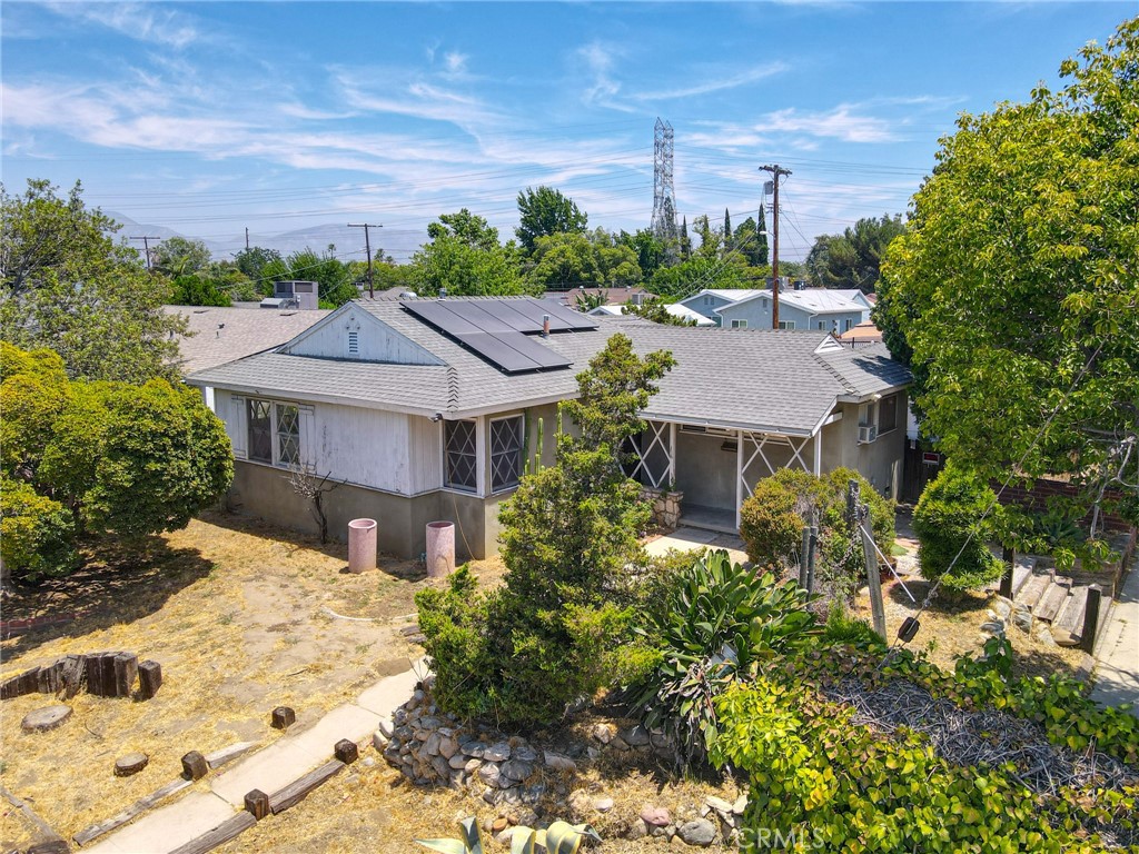 Welcome to this charming corner lot home in the desirable Mission Hills neighborhood of Los Angeles! This property, located at 10330 Woodman Ave, offers a wonderful opportunity for buyers looking to make their mark on a well-located residence. With 3 bedrooms and 2 bathrooms spread across 1,172 square feet of living space, this home provides a comfortable and functional layout that is perfect for families or individuals seeking for an investment opportunity. There is tremendous potential to transform this space into a personalized oasis. Additionally, the property sits on a generous 7,113 square foot lot, offering plenty of outdoor space for various activities and future expansion possibilities. One of the unique features of this property is the detached 400 Sqft Accessory Dwelling Unit (ADU) located at the back with its own address on Blackhawk. This presents an excellent chance for multigenerational living, potential rental income, or even a private home office space to cater to various lifestyle needs. Currently, it is tenant occupied and will be delivered with tenants who are on a month-to-month basis. Conveniently situated in Mission Hills, this residence enjoys easy access to a plethora of amenities, schools, parks, shopping, and dining options. The neighborhood's strong sense of community and proximity to major transportation routes make it a prime location for both practicality and comfort. Don't miss this chance to invest in a property that allows you to put your personal touch on it, unlocking its full potential.