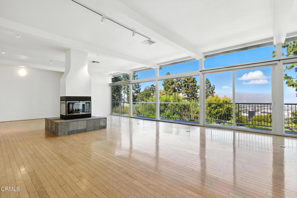 Perched at the top of the hill just off Mulholland, this beautifully updated 3-bedroom, 5-bath home offers stunning panoramic views through dramatic floor-to-ceiling windows. Freshly painted and thoughtfully renovated with numerous upgrades, the home seamlessly blends style, comfort, and functionality.Enjoy indoor-outdoor living with a brand-new deck overlooking a sparkling pool, perfect for entertaining or unwinding in privacy. The spacious floor plan is complemented by central air and heat, ensuring year-round comfort.Nestled on a quiet cul-de-sac, the property is centrally located just minutes from Studio City, Sherman Oaks and West Hollywood, with easy access to premier shops, dining, and entertainment. Families will appreciate the award-winning Blue Ribbon schools, and the home is also pet-friendly.Call today for availability and private showings!