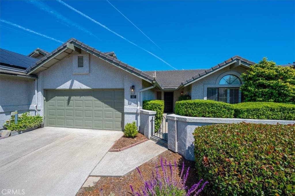 Single Level Luxury at Wildwood Ranch!
Tucked away among 32 acres of mature oak trees, this exceptionally clean single-level home is located just outside the charming Village of Arroyo Grande.
Flooded with natural light, the home features an open and airy layout with vaulted ceilings, remodeled kitchen, plantation shutters, newer windows and flooring and a cozy gas fireplace.
The primary suite boasts a spa-like bathroom that is recently remodeled with an oversized shower and walk in closet! A spacious second bedroom sits adjacent to another beautifully updated bathroom. There’s also a generous bonus room ideal for an office, formal dining room, or hobby space.
Enjoy a thoughtful floor plan that includes indoor laundry and an attached two-car garage. Outdoor living is easy with two private patios, perfect for relaxing or entertaining in peaceful surroundings.
Residents of Wildwood Ranch enjoy exclusive access to amenities such as a clubhouse, tennis court, outdoor BBQ area, and a scenic one-mile walking trail. The community also includes common area landscaping and a private greenbelt, offering safe, low-maintenance living.
With only 65 homes in this unique development, this is a rare opportunity to experience the best of Central Coast living.