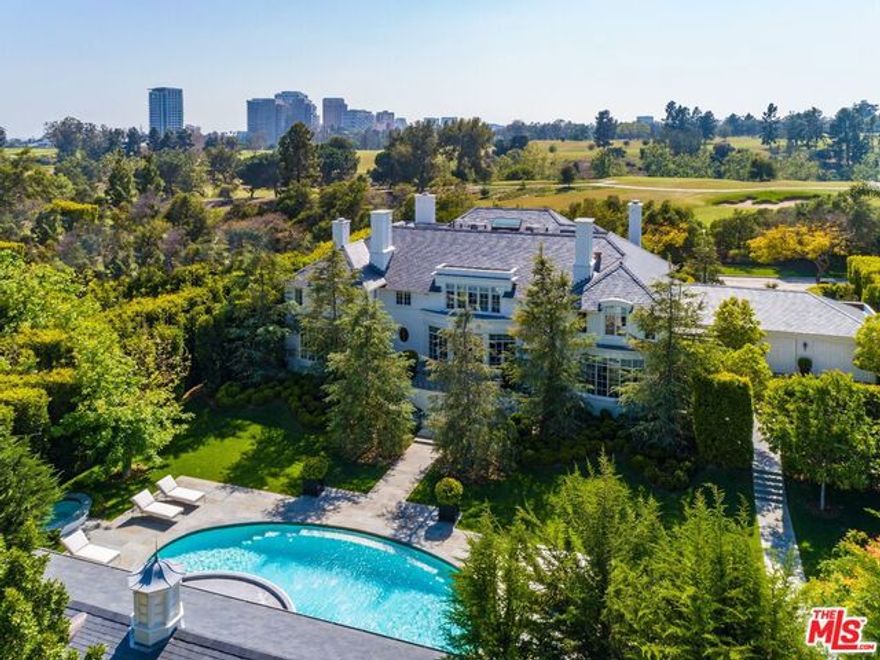 The Rutherford House offers a rare combination of exquisite architecture, craftsmanship & distinct design. Inspired by Paul Williams & European influences, this contemporary Art Deco masterpiece has been meticulously renovated with attention to detail like no other. Enter to a stunning formal entry w/ high ceilings & stair hall opening to a dramatic floor plan that seamlessly blend indoor-outdoor living w/ stunning vista views of the private garden, oval pool & pavilion. Features formal living rms, Ruhlmann-inspired library, bar, billiards & grand morning rm. Spectacular kitchen w/ mosaic ceiling & elliptical dining rm w/ bronze Parisian screens & expansive poolside views. Sabino light fixtures, French doors, bowed bay windows & custom fixtures throughout. Reminiscent of old Hollywood, the stunning master suite includes his/her marble bathrms, oversized closets & intimate living rm overlooking landscaped grounds. Here's your chance to become part of classic Beverly Hills history.