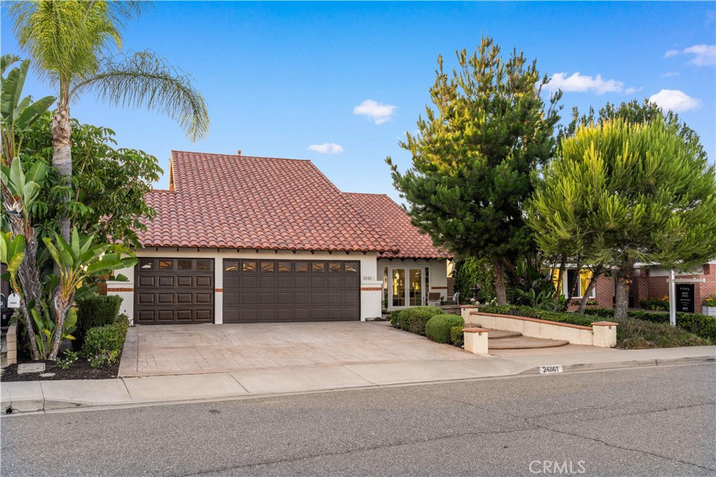 Welcome to this artistically remodeled pool home, ideally located in a mature and tranquil neighborhood of Laguna Hills. With no HOA, low property taxes, and access to the highly acclaimed Saddleback Valley School District, this home delivers the perfect blend of comfort, convenience, and value.
Boasting stunning curb appeal, the exterior features flowing water fountains, a welcoming front yard sitting area, tree-lined side yard, a private driveway, and a 3-car garage.
Inside, fine craftsmanship shines through every inch of this thoughtfully renovated residence. Step into a bright, open interior with soaring ceilings, newly remodeled stairways, and a seamless blend of modern design and warmth. The living room opens through brand-new French doors to the front porch, offering serene views of lush landscaping and the gentle sounds of the fountain.
The formal dining room is highlighted by luxury wood-textured flooring, large sliding windows, and elegant pendant lighting. The gourmet kitchen is a chef’s dream, featuring new stainless-steel appliances, white shaker cabinets with solid wood drawers, marble-style quartz countertops and backsplash, and sleek new hardware.
Enjoy effortless indoor-outdoor living as the breakfast area and family room flow directly to the backyard retreat. Perfect for multi-generational living, a guest bedroom with full bathroom is conveniently located on the main level.
Upstairs, discover four additional bedrooms and three updated bathrooms, including two en-suites. The primary suite impresses with vaulted ceilings, double-pane French doors, and a private balcony offering sweeping views. The primary bath features dual vanities, a walk-in shower, and a sunlit soaking tub room for the ultimate in relaxation.
Additional bathrooms are outfitted with new quartz vanities, modern walk-in showers with barn door closures, and updated lighting and ventilation.
Step outside to your own private oasis—a sparkling oversized pool and spa, built-in BBQ island with fridge, generous patio space, and mature trees create the perfect backdrop for entertaining or quiet retreat. The spacious side yard includes raised garden beds, natural turf, and a peaceful reading nook.
Just a short walk to community parks, Laguna Hills Plaza, Target, and only one minute from the I-5 freeway, you’ll enjoy unmatched accessibility while still relishing peaceful residential living.
This is more than just a house—it's the lifestyle upgrade you’ve been waiting for.