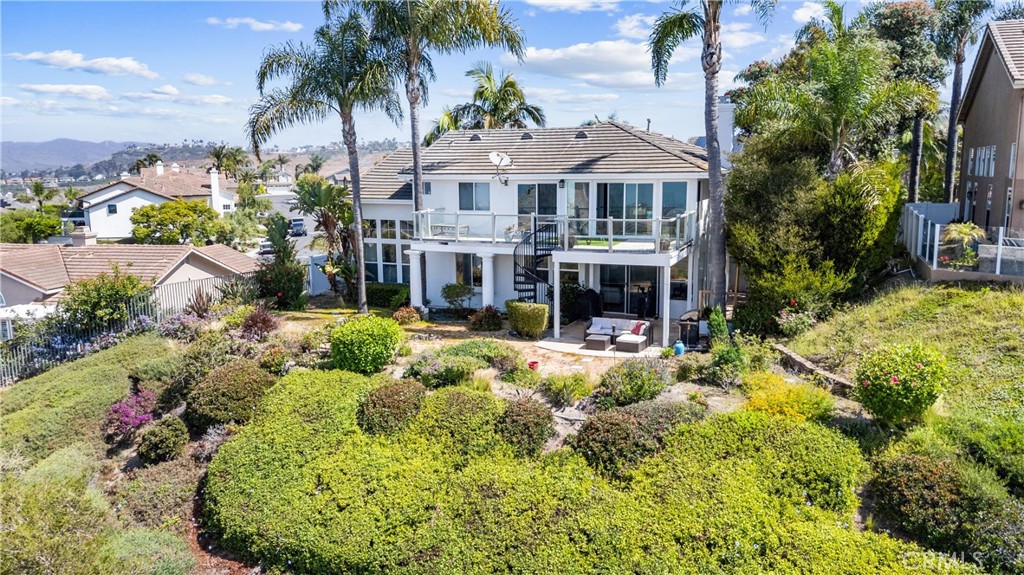 Prestigious Panoramic Ocean View Estate in Marblehead
Experience coastal luxury at its finest in this exquisitely remodeled residence, perfectly positioned within the exclusive gated community of Marblehead. Boasting unobstructed, sweeping ocean views, this home offers a front-row seat to the Pacific from the main-level family room, gourmet kitchen, and elegant dining area.
Upstairs, the expansive primary suite features a private viewing deck—ideal for capturing breathtaking sunsets and sea breezes. The spa-inspired primary bath is a sanctuary of indulgence, showcasing dark-stained cabinetry, gleaming granite surfaces, glass vessel sinks, a separate makeup vanity, and a spacious stone-clad walk-in shower.
The chef’s kitchen has been thoughtfully reimagined with rich cabinetry, granite countertops, premium stainless steel appliances, and a stunning travertine backsplash that extends to the accent wall. Throughout the home, refined finishes such as warm wood flooring, crown molding, and plantation shutters enhance the ambiance of timeless sophistication.
All bedrooms are located upstairs, each beautifully appointed with custom details and designer touches. The generous backyard provides a private retreat, perfect for entertaining or relaxing amid lush landscaping.
Set within a meticulously maintained and secure gated enclave, this distinguished home embodies the pinnacle of elegant coastal living.