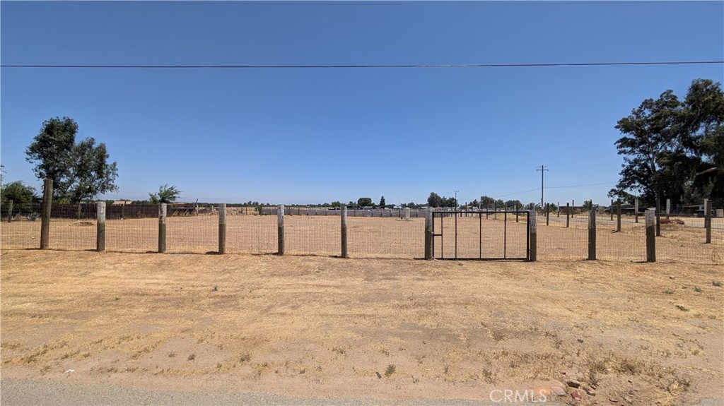 This is a blank canvas property with 2.7 acres of fenced land. The owner just installed a brand new well. Property is located adjacent to a tow yard and is has always just been used for auto storage. There is no structure on the property. Buyer to check with county for any potential use.