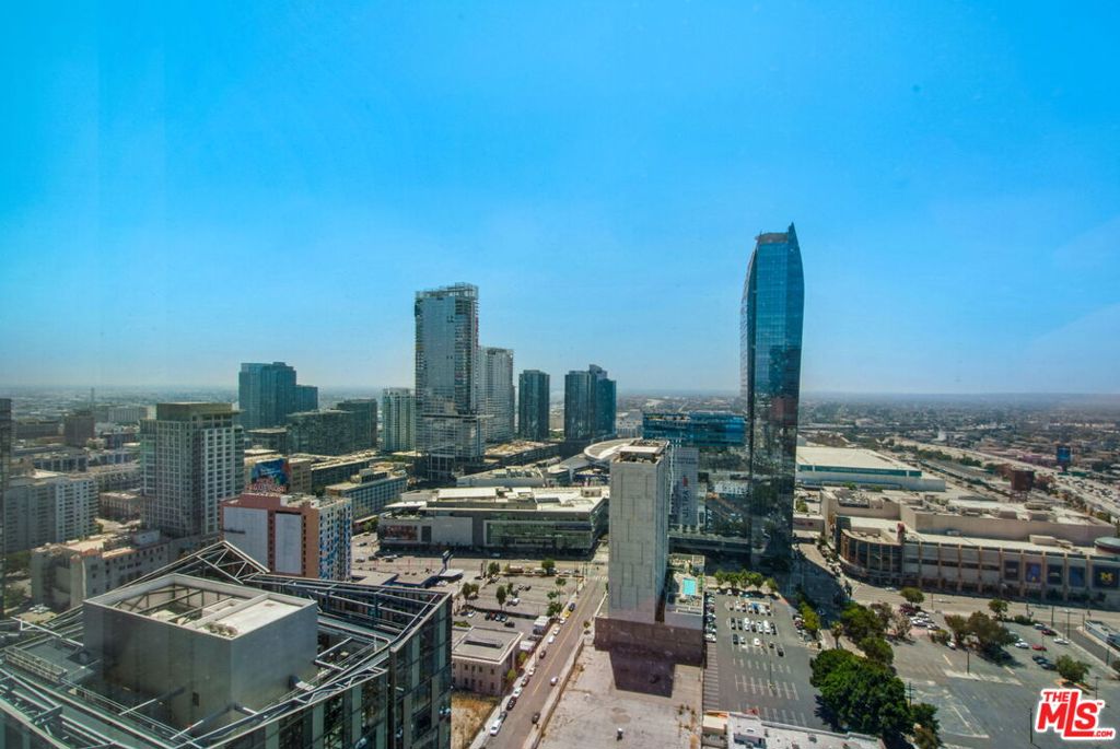 Views are not created equal at Metropolis Tower 1! Experience luxury living high above the city on the 34th floor. This elegant 1-bedroom, 1.5-bath residence offers 843 sq. ft. of contemporary design with dramatic floor-to-ceiling windows. Step inside to a light-filled modern kitchen that flows seamlessly into a spacious living room with breathtaking views of Crypto Arena, LA Live, and the glittering city lights. Soaring ceilings, Travertine floors, and refined finishes create a home that feels both stylish and sophisticated. The unit also includes in-unit washer/dryer, storage, and dedicated parking. Life at Metropolis is more than a home, it's a lifestyle. Amenities include a resort-style pool & spa, sky park, state-of-the-art fitness center, yoga studio, private screening room, and 24-hour concierge services. Just steps from Downtown LA's dining, shopping, entertainment, and freeway access. This is your time to live in luxury!