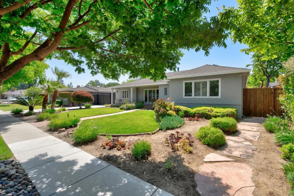 Experience the perfect blend of luxury and comfort in this beautifully renovated resort-style home, nestled in one of Willow Glens most sought-after neighborhoods. The total square footage is 2,923 including the 764 sf ADU. Just moments from top-rated schools and vibrant downtown Willow Glen, this exceptional one-story residence is both sophisticated and versatile. The main home features an expansive culinary kitchen with custom cabinetry, slab granite counters, and top-of-the-line appliances. The primary suite boasts French doors leading to the serene back gardens and a spa-like primary bath includes a soaking tub, dual sinks, a walk-in shower, and a custom-built walk-in closet. Adding to the homes versatility, the spacious 1-bed, 1-bath ADU is perfect for guests, multi-generational living, or rental. Step outside to your private resort-style backyard, complete with a sparkling solar-heated pool and spa with a motorized safety cover, a terrace with pergola, and lush landscaping featuring fruit trees. Detail defines this home, with hardwood floors throughout, a 9.0+ KW solar system, Ring security cameras, smart switches and door locks, five skylights, and six French doors ensuring abundant natural light. Rare oportunity to own a standout property. Schedule a tour today!
