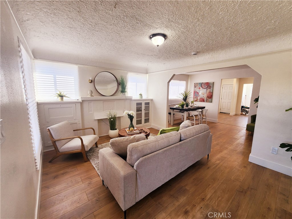 Great opportunity in the heart of Los Angeles. Welcome to this beautifully updated 1925 charmer. This 2 bedroom, 1 bathroom home offers modern upgrades while keeping it's timeless character. Inside you'll immediately notice recessed lighting, fresh paint, and new flooring throughout. The remodeled kitchen features granite countertops, new cabinets, and stylish finishes, while a laundry room is located off the kitchen. The bathroom shines with marble tile and new finishes. A spacious backyard provides endless possibilities for entertaining, gardening, or future expansion. Major updates include a new roof and water heater. This home qualifies for a $20,000 City National Bank grant.