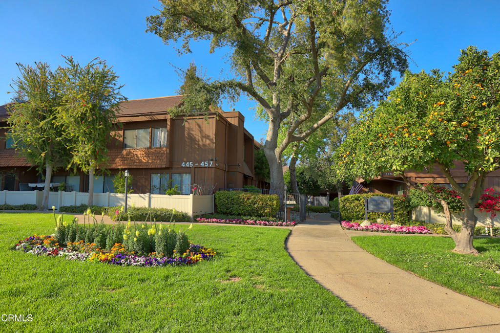 The Arcadia Woods townhome complex is arguably one of the most beautiful in Arcadia. Tall mature trees, manicured landscaping, large grassy area, and meandering walkways provide the perfect backdrop to this 1973 built complex. The '449' building is in the rear of the property and Unit 1 is the end unit.With only one shared wall, Unit 1 offers a bit more natural light and privacy. The main floor includes a living room with fireplace, recessed lighting, and built-in bookshelf. The dining area is adjacent to the kitchen and offers a sliding door to the enclosed patio. The kitchen offers plenty of cabinets, stainless appliances, and granite countertops. There is also a powder room on the main floor. Upstairs are the two bedrooms and additional bathrooms. The guest bedroom is nicely sized with a large window and ceiling fan. The primary bedroom has a vaulted ceiling and its own bathroom. Additional features include separate laundry area upstairs and a two-car detached garage.