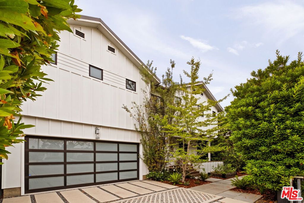 Life at 1023 Superba Ave flows easily with 10-foot ceilings and a wide-open great room that set the stage, a kitchen where weeknight pasta comes together as easily as weekend baking projects, and Fleetwood sliders that send everything outdoors to a backyard built for barbecues, spa soaks, and long Venice evenings. Built in 2015, this modern farmhouse combines polished design with an easy, everyday rhythm. Wide-plank wood floors and a sleek gas fireplace anchor the main level, while the kitchen strikes the perfect balance between form and function: Carrara counters and Thermador appliances add refinement, and a large pantry and oversized island make prep work and cooking seamless. Two sets of sliding doors lead outside onto a mahogany deck with built-in BBQ and sink, an in-ground spa, grassy lawn, and multiple patios where friends linger and nights stretch a little longer. Upstairs, the layout keeps life simple: all bedrooms on one level, plus a den and laundry room. The primary suite is its own retreat with a largewalk-in closet, spa-like bath with soaking tub and oversized glass shower, and a private terrace that feels like an outdoor living room. A two-car garage plus additional driveway parking add ease to daily life - a rare find in Venice. And when you're ready to step out, the best of Venice is right nearby - morning coffee at Companion, dinner at Superba, errands at Whole Foods, or a stroll down Abbot Kinney.