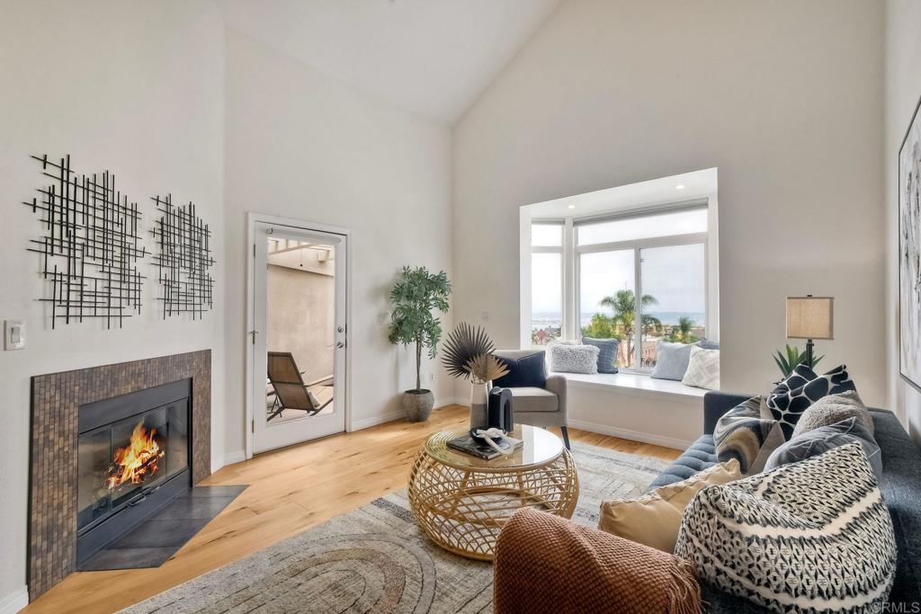 Premier Bay Views in the Heart of Bankers Hill. This top-floor residence at Laurel Bay offers sweeping westerly views of San Diego Bay and the city skyline from one of the community’s most desirable locations. Thoughtfully renovated, the home features an upgraded kitchen, refreshed bathrooms, new flooring, and fresh paint, creating a move-in-ready space with modern style. The open main level flows seamlessly from the updated kitchen to a bright living area with spectacular sunset views. Upstairs, the versatile loft -complete with its own en suite bathroom and closet - is ideal as a guest suite, home office, or additional bedroom. Additional highlights include two dedicated parking spaces, in-unit laundry, and access to Laurel Bay’s resort-style amenities with pool and gym. Located just steps from Balboa Park, Little Italy, the Gaslamp Quarter, and San Diego’s best dining, shopping, and entertainment. Enjoy the perfect blend of urban convenience, modern upgrades, and breathtaking views in this exceptional home.
