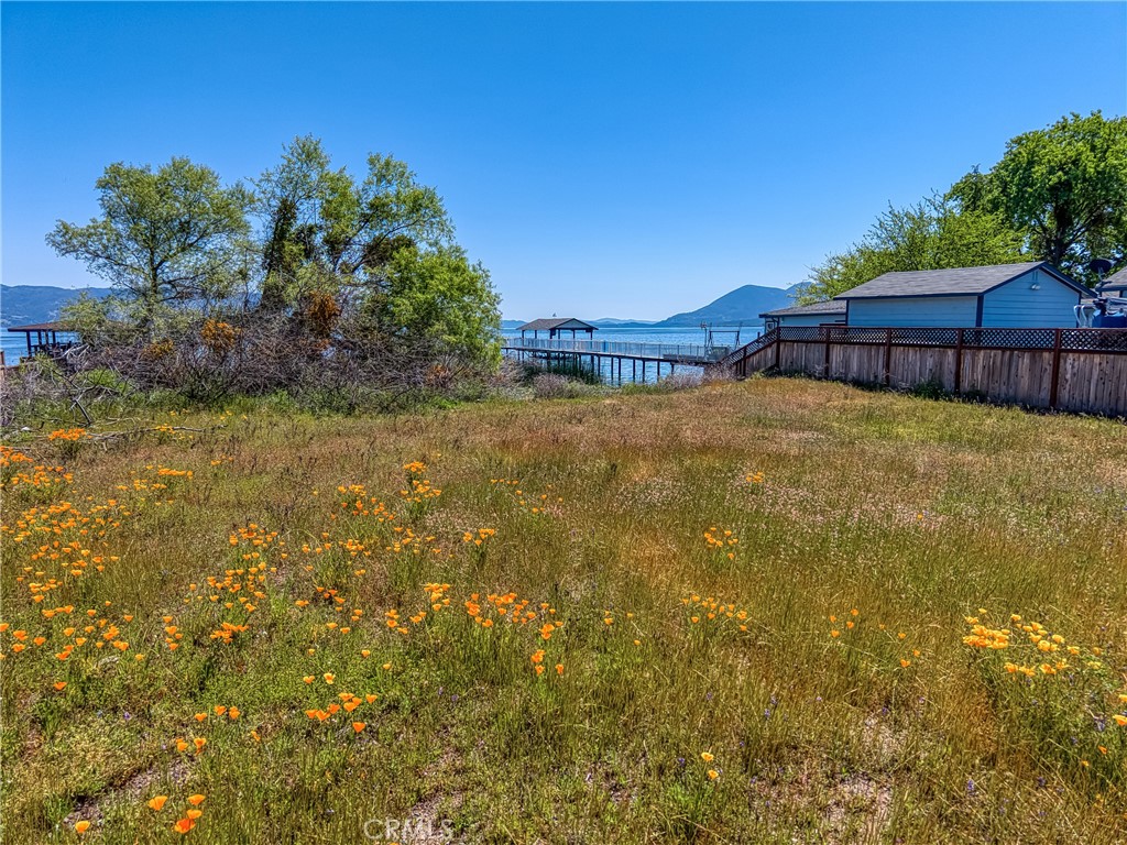 Discover the potential to create your ideal lakefront residence on this exceptional and affordably priced lot in Lakeport. This flat, usable parcel offers breathtaking panoramic views of the lake and direct access to the waterfront, promising year-round enjoyment of lake activities. The property is conveniently equipped with all essential utilities, including power, water, and sewer connections readily available at the adjacent County Maintained City Street. The spacious 0.41-acre (17,860) lot provides ample room to accommodate a custom-designed home to suit your preferences. A continuous rock seawall is already in place, enhancing the protection and integrity of the property. Its prime location is just a short drive from downtown Lakeport, where you can find a variety of shops, restaurants, and community events. Additionally, local parks and multiple boat launch facilities are easily accessible. Notably, a new high-volume water meter has been installed, and sewer and power utilities are located directly on the property, streamlining the building process. This is a unique chance to secure a desirable lakefront property and build the home you've always envisioned. Located only 2.5 Hours from San Francisco and 2 Hours from Sacramento. Lakeport is a charming town with fun year-round activities for the whole family.
