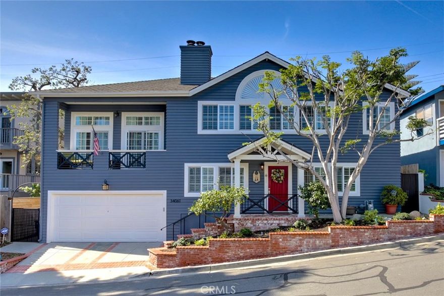 Welcome to your dream home in the heart of Dana Point’s Lantern District — Southern California’s most sought-after seaside community. Lovingly upgraded and impeccably maintained, this residence invites you to move right in and enjoy a lifestyle of refined coastal elegance.The spacious kitchen is a sleek, chef-inspired showpiece with crisp white cabinetry, Caesarstone counters, travertine flooring, stainless steel appliances, and a generous island perfect for entertaining or casual family gatherings. The open living and dining areas flow effortlessly, showcasing distressed hardwood floors, plantation shutters, a custom staircase, and a stacked-stone fireplace that evokes warm, seaside charm. French doors invite the gentle ocean breeze and create a seamless connection to outdoor living. A private family room provides its own retreat with fireplace, plantation shutters, and balcony, while the main floor also features a bedroom and full bathroom — offering mirrored wardrobe space and thoughtful design details. The bathroom is beautifully appointed with marble counters and a custom shower/tub surround, reflecting careful attention to both style and functionality. Upstairs, the Master Suite is a sanctuary of coastal sophistication. High ceilings and sliding wood closet doors with custom organizers offer both elegance and practicality. The fully remodeled Master Bath is a showstopper: a sliding barn door entry expands the entryway to an oversized bathtub with LED lighting and hydrotherapy jets, paired with an open-concept walk-in shower accented by a striking backsplash, deliver spa-like luxury with a sleek, coastal-modern design. The backyard is an entertainer’s dream, with custom brick and flagstone hardscape, a “Fire & Ice” fire pit, ambient lighting, and a flat-screen setup perfect for outdoor gatherings beneath the coastal sky. From this prime Lantern District location, the best of Dana Point living is at your doorstep. The trending Town Center offers restaurants, shopping, and gathering spaces, while the Dana Point Harbor is currently under construction and, when finished, will add tremendous value to the community. Enjoy nearby world-class resorts, including the Ritz-Carlton and Waldorf Astoria, and iconic beaches such as the Strand at Headlands and Salt Creek Beach. With thoughtful upgrades throughout and effortless proximity to the ocean, this home delivers the quintessential coastal lifestyle — where every detail celebrates seaside living at its finest.