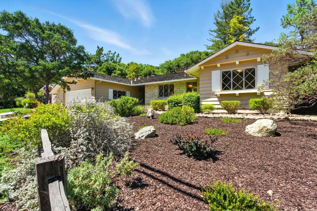 This warm and inviting 4 bedroom, 2.5 bathroom home offers over 2,000 sq ft of living space on a 10,544 sq ft lot. The formal entry opens into a spacious living room with hardwood floors, a cozy fireplace, and walls of windows that bring the outdoors in. The spacious kitchen with a large center island opens to the dining area or family room creating the perfect setting for family meals and gatherings with friends. From there, enjoy easy access to the backyard with patio and sprawling lawn. The primary suite, set down the hall, offers a true retreat with ample closet space and a dressing area. Three additional bedrooms share a full hall bath, providing flexibility for family, guests, or a home office. Everyday convenience is built in with a well-placed half bath, separate laundry room, and attached 2-car garage. Minutes from the vibrant downtown restaurants and shops. Excellent San Carlos schools! Close proximity to hiking trails, parks and major streamlined commute routes.