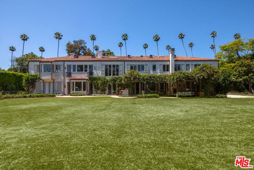 Just renovated! One of the most prized (and largest) properties in the highly desirable flats of Beverly Hills, this nearly 11,000 square foot updated Mediterranean style residence sits on 1.2 park like acres. The main home features 8 bedrooms, 7 full bathrooms and three half baths as well as a one bedroom guest house with kitchen and garage. The interior boasts dramatic scale with a formal living, dining room, double height great room, chef's kitchen with breakfast bar, large butler's pantry, and screening room. The master with a fireplace, features luxurious dual bathrooms and oversized walk-in closets. The property also includes 2 swimming pools, a lighted sports court, garages for 5 cars and is a short walk to the shops and restaurants of Beverly Hills. An Estate of this magnitude rarely becomes available in the flats of Beverly Hills.